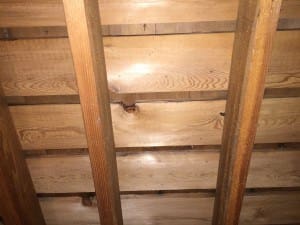 The only way to be sure to know whether a house has had a cedar roof is to look in the attic. Looking at a gable end can be helpful, but it's no guarantee that you'll catch whether the roof has cedar or not.